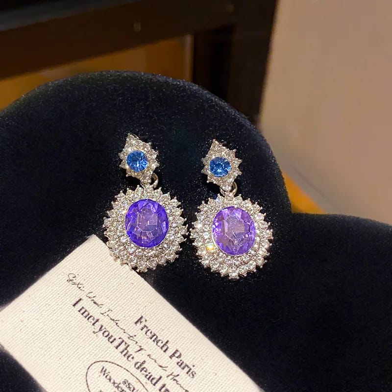 Aretes glamour con cristal morado