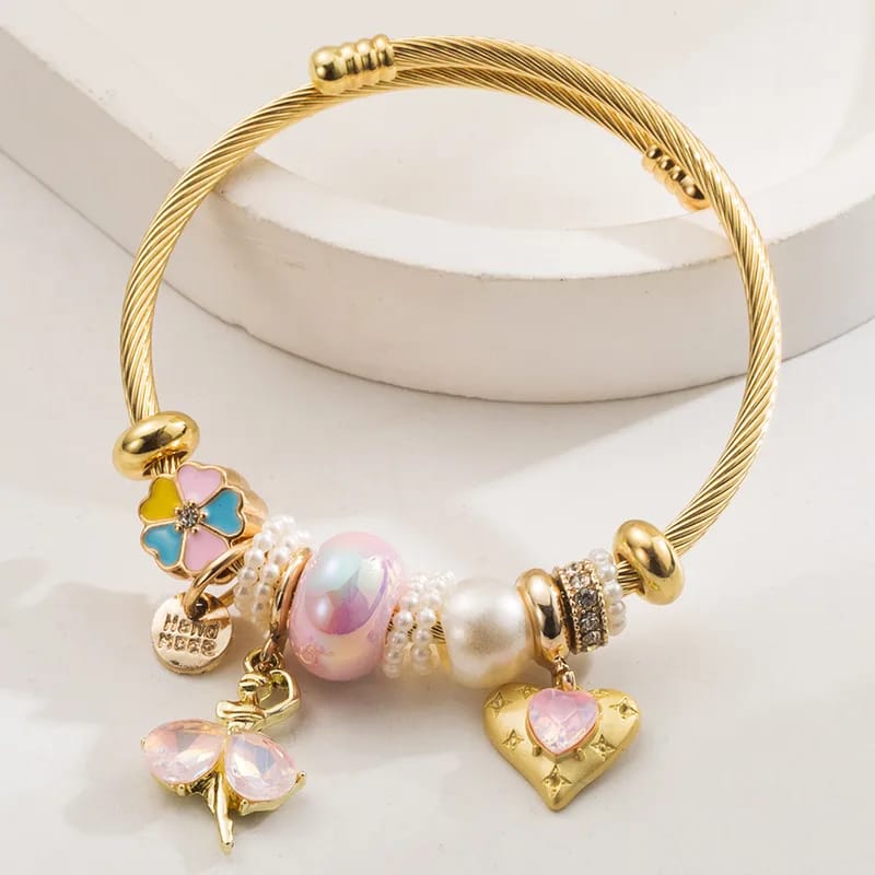 Pulsera tipo pandora con tonos rosados