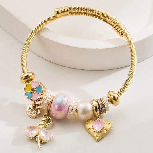 Pulsera tipo pandora con tonos rosados